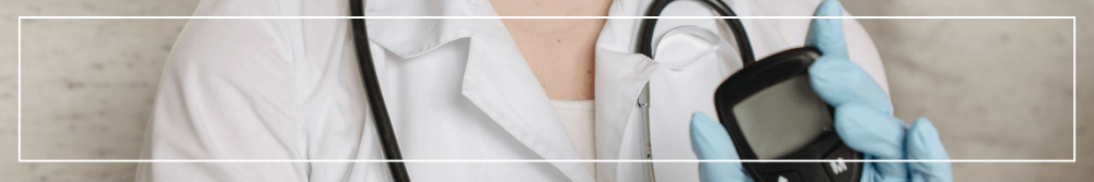 doctor with a diabetes monitor