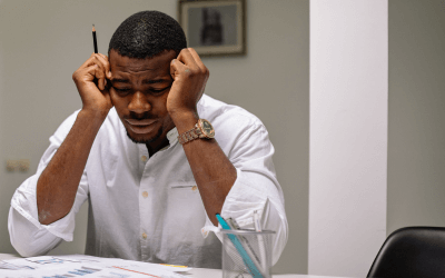 man with headache at work