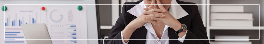 woman with migraine in office