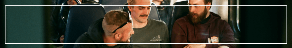 3 men sat together talking