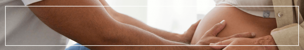 couple feeling pregnancy baby bump