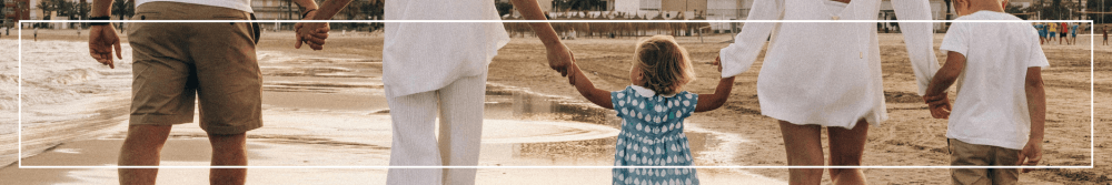 family walking on the beach