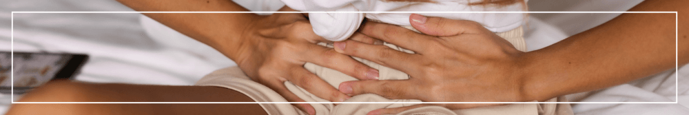 Endometriosis awareness_ woman holding hands on stomach