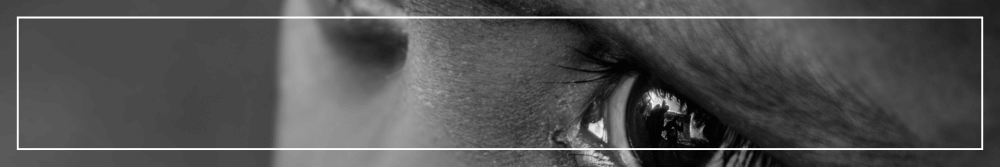 black and white image of childs eyes